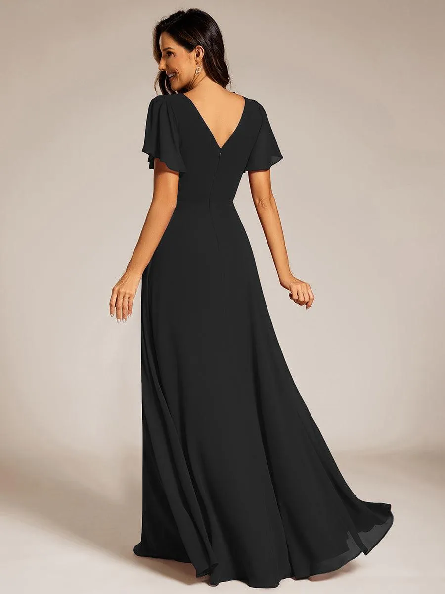 Robe de soirée plissée trapèze en mousseline de soie manches courtes et taille à sequins