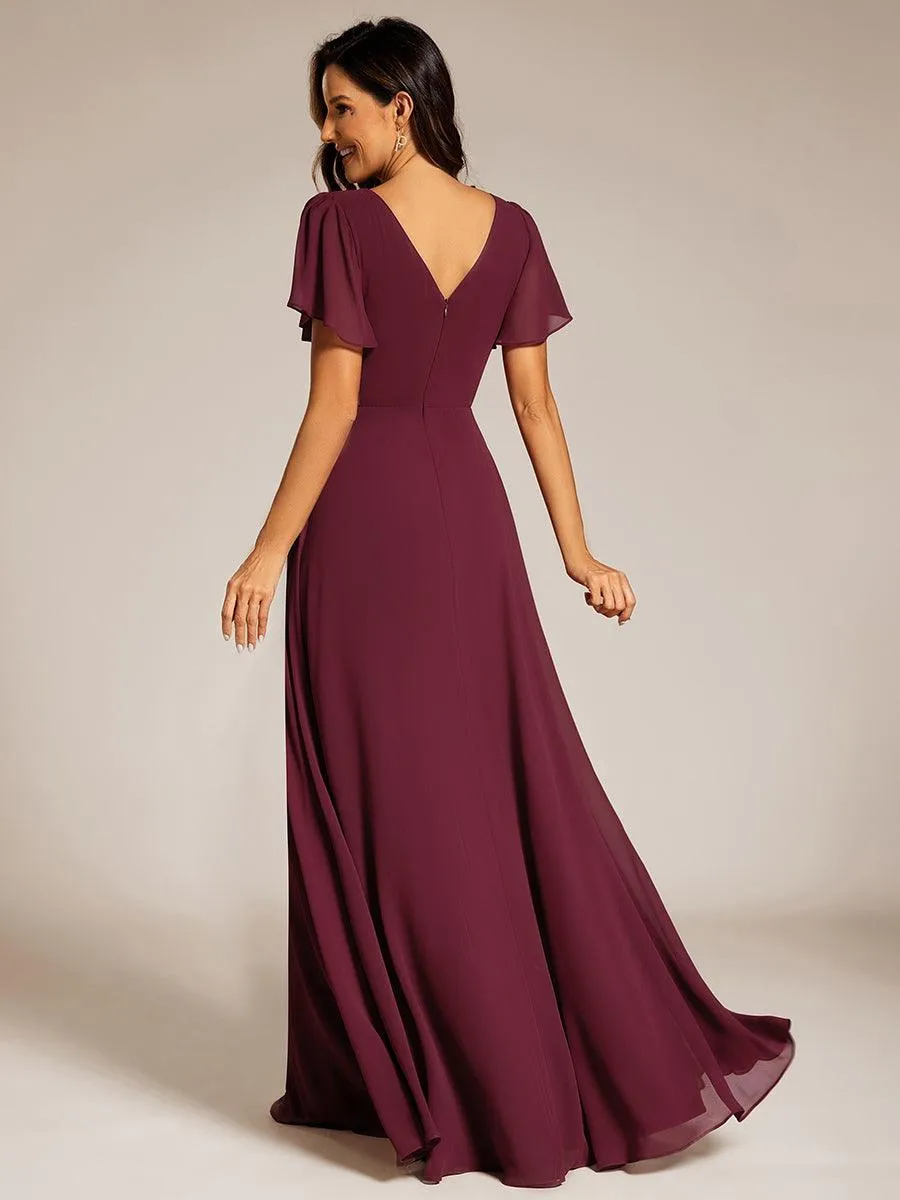 Robe de soirée plissée trapèze en mousseline de soie manches courtes et taille à sequins