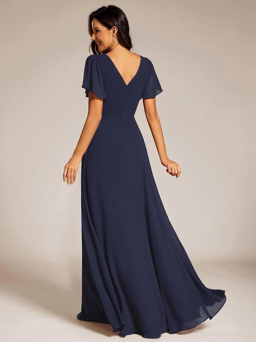 Robe de soirée plissée trapèze en mousseline de soie manches courtes et taille à sequins