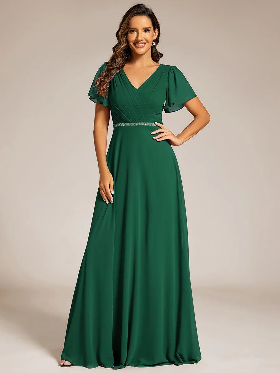 Robe de soirée plissée trapèze en mousseline de soie manches courtes et taille à sequins