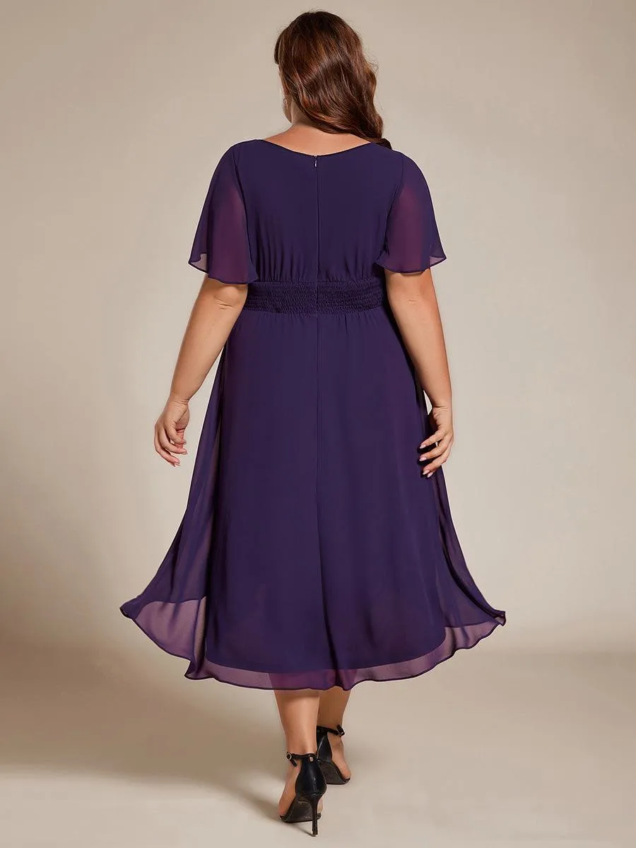 Robe d'invité de mariage trapèze en mousseline fluide à encolure ronde et longueur au genou