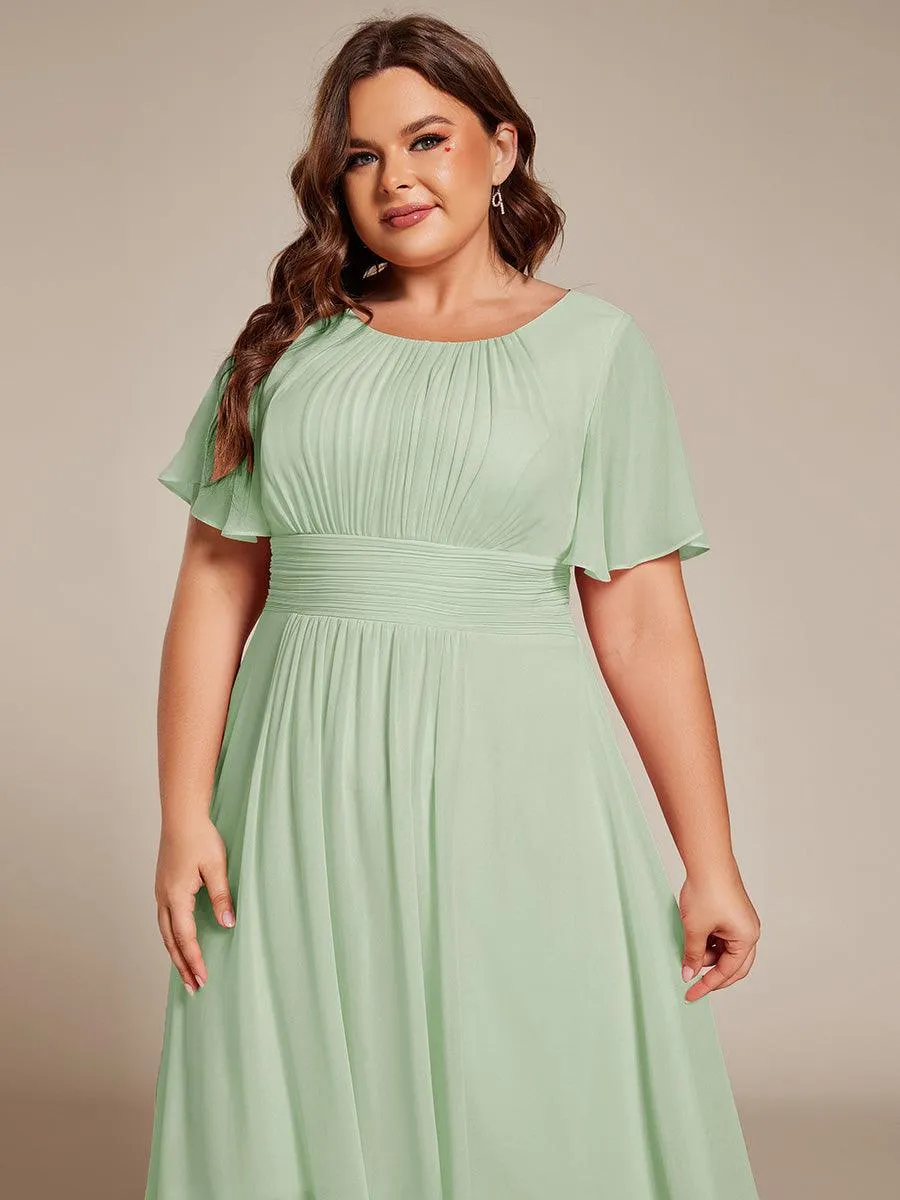 Robe d'invité de mariage trapèze en mousseline fluide à encolure ronde et longueur au genou