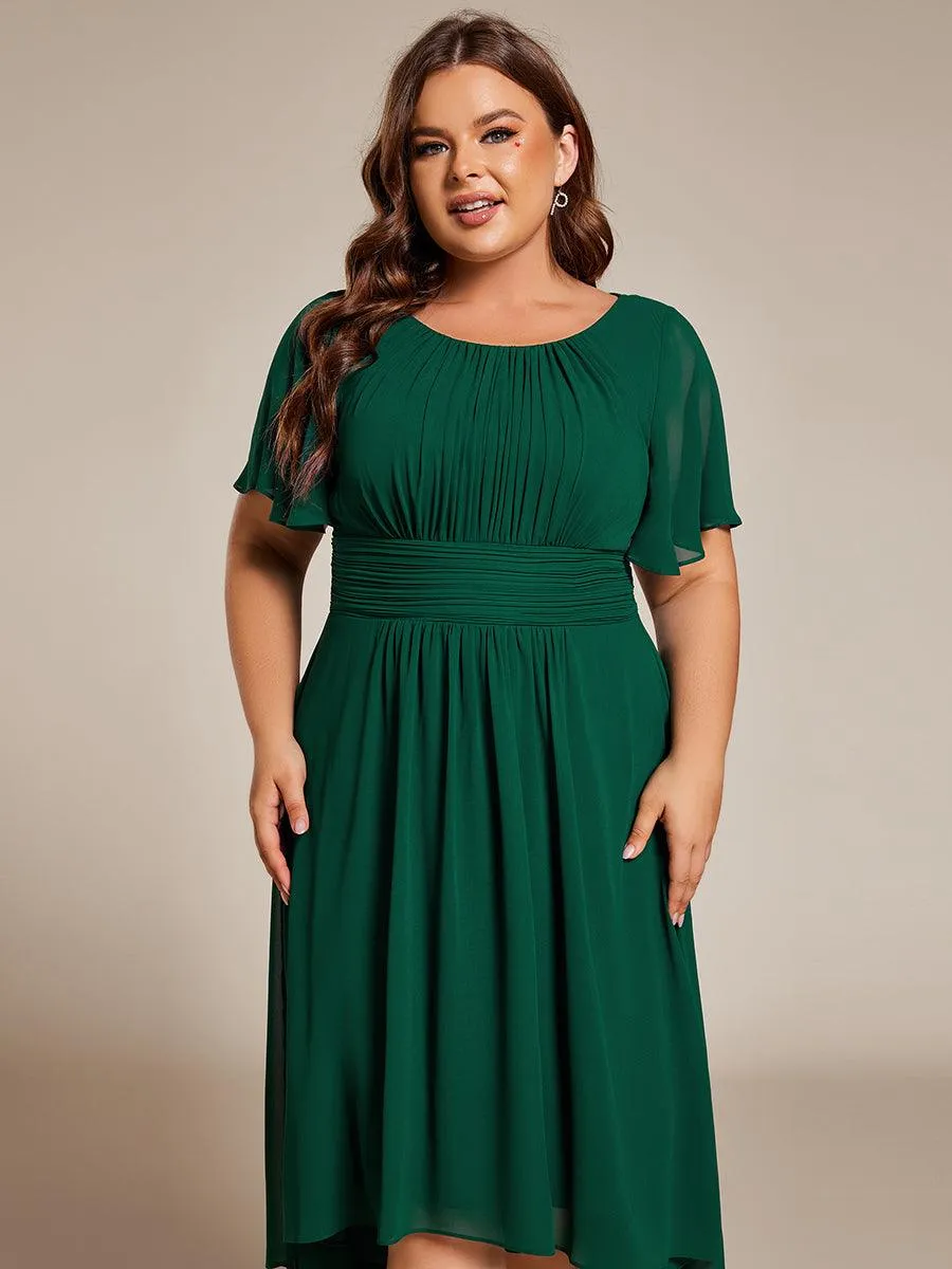 Robe d'invité de mariage trapèze en mousseline fluide à encolure ronde et longueur au genou