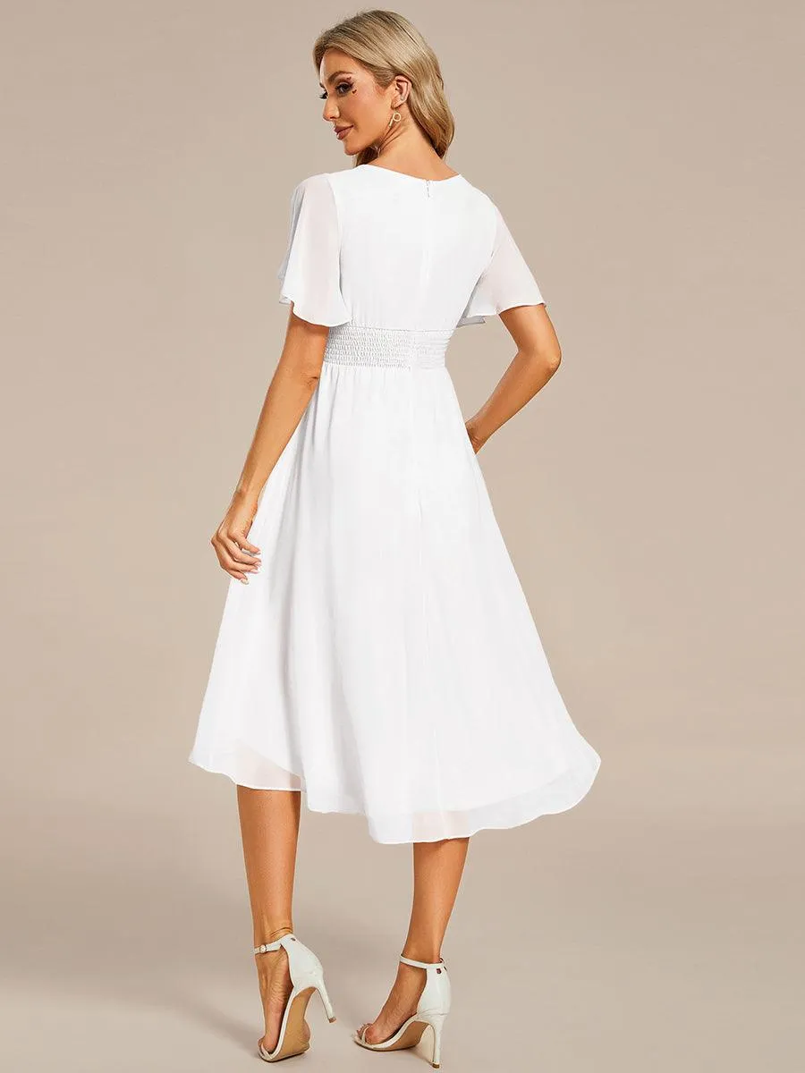 Robe d'invité de mariage trapèze en mousseline fluide à encolure ronde et longueur au genou