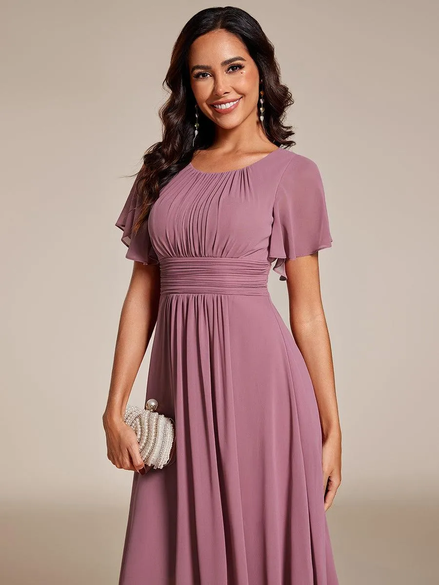 Robe d'invité de mariage trapèze en mousseline fluide à encolure ronde et longueur au genou