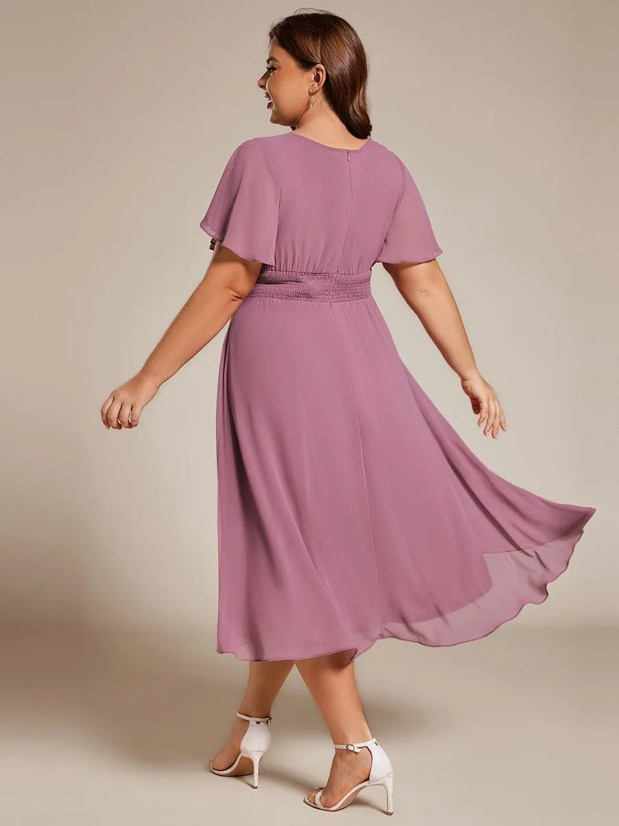 Robe d'invité de mariage trapèze en mousseline fluide à encolure ronde et longueur au genou